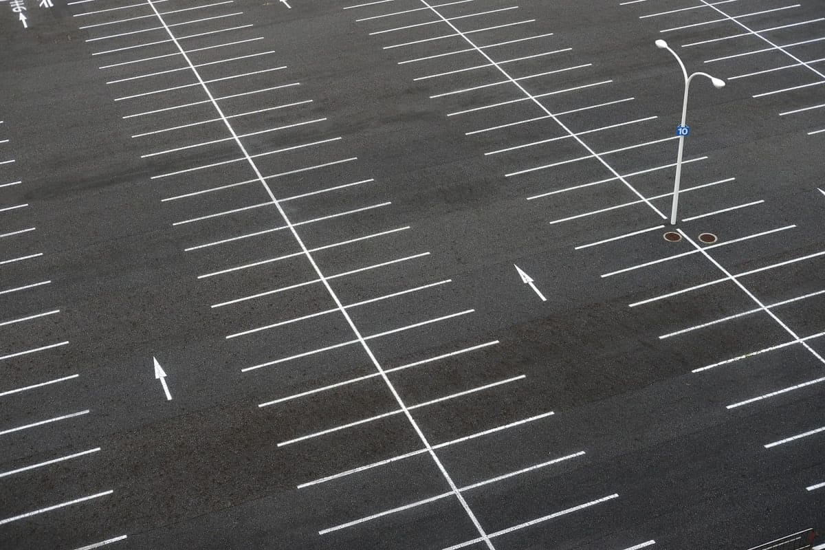 Completed parking area with marked bays and signage