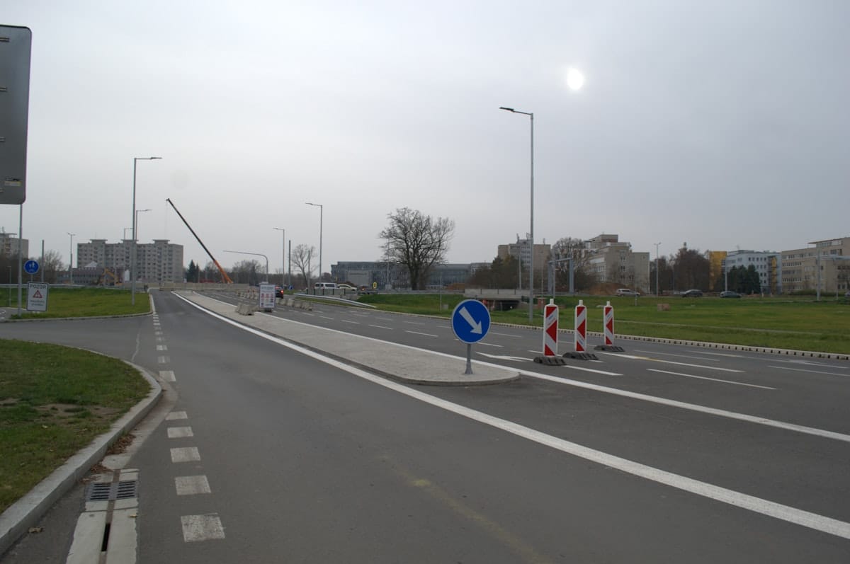 Road construction machinery laying new tar surface
